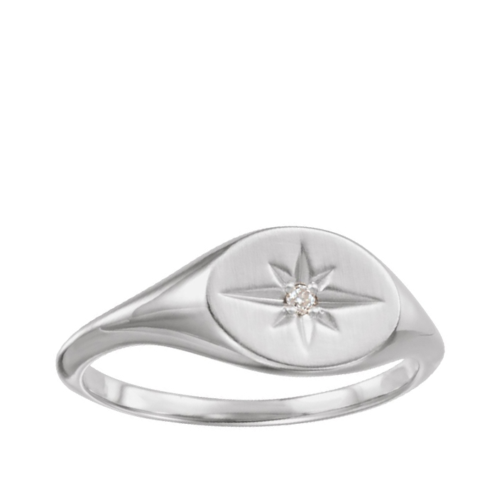 white gold signet ring with starburst design and diamond accent