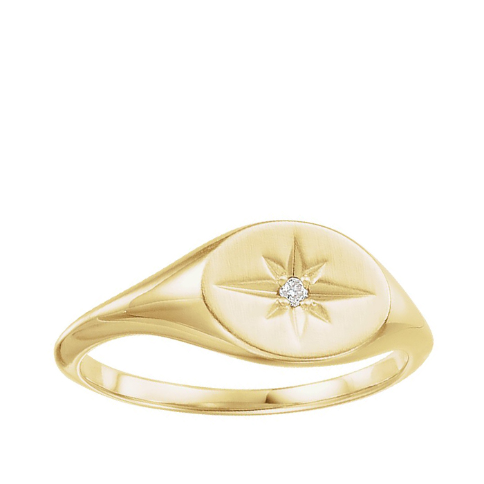 yellow gold signet ring with starburst design and diamond accent
